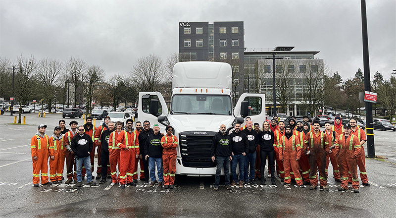 Mechanical students standing in front of semi truck