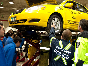 Automotive service technician students teamed up with the taxi inspector and police to perform vigorous safety checks on rebuilt taxis. 